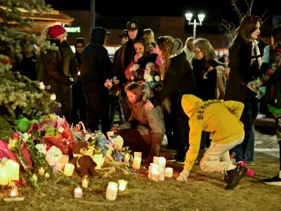 People react during a vigil, the day after a deadly mass shooting took place, in the town of Tumbler Ridge, British Columbia, Canada February 11, 2026. REUTERS/Jennifer Gauthier REFILE - FIXING TYPO IN LOCATION