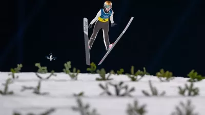 Nika Prevc, of Slovenia, soars through the air during the ski jumping mixed team competition at the 2026 Winter Olympics, in Predazzo, Italy, Tuesday, Feb. 10, 2026. (AP Photo/Kirsty Wigglesworth)