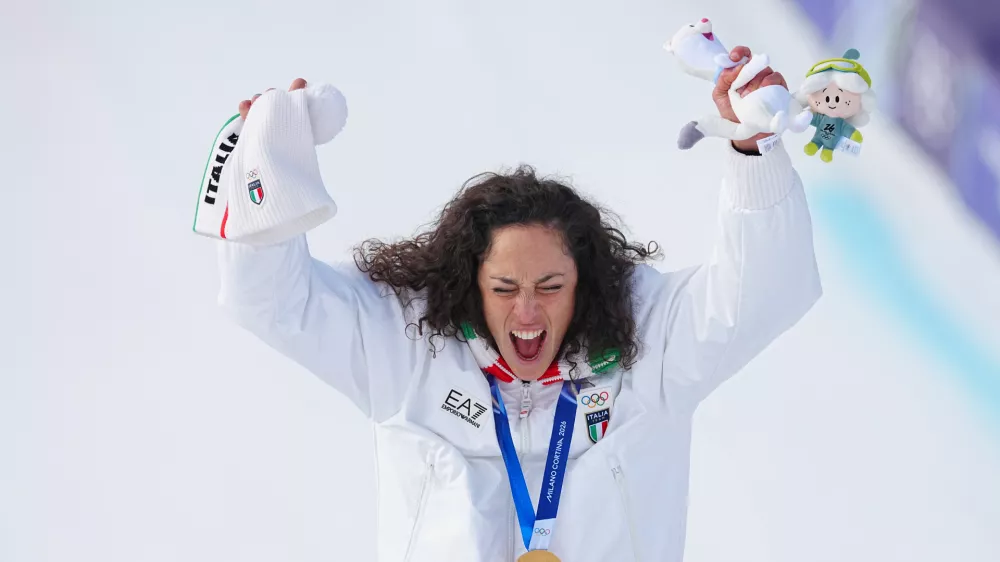 12 February 2026, Italy, Cortina D'ampezzo: Italy's gold medalist Federica Brignone celebrates on the podium of the Women's Super-G event at the Tofane Alpine Skiing Centre in Cortina d'Ampezzo during the Milano Cortina 2026 Winter Olympic Games. Photo: Michael Kappeler/dpa