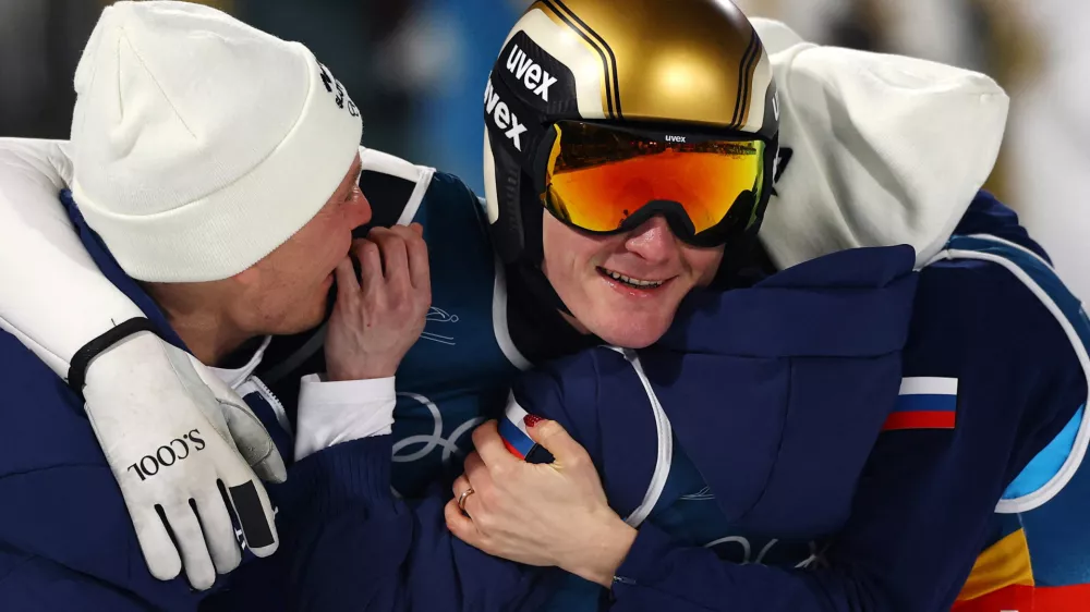 Milano Cortina 2026 Olympics - Ski Jumping - Mixed Team - Predazzo Ski Jumping Stadium, Predazzo, Italy - February 10, 2026. Nika Vodan of Slovenia, Anze Lanisek of Slovenia, Domen Prevc of Slovenia and Nika Prevc of Slovenia celebrate winning the gold medal after the final round. REUTERS/Kai Pfaffenbach   TPX IMAGES OF THE DAY