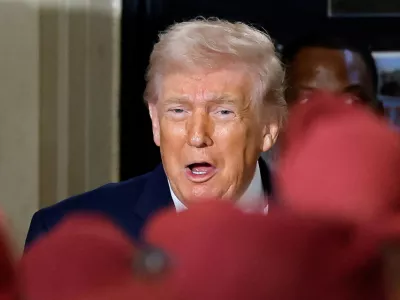 FILE PHOTO: U.S. President Donald Trump reacts during a visit at Fort Bragg, North Carolina, U.S., February 13, 2026. REUTERS/Jonathan Drake/File Photo