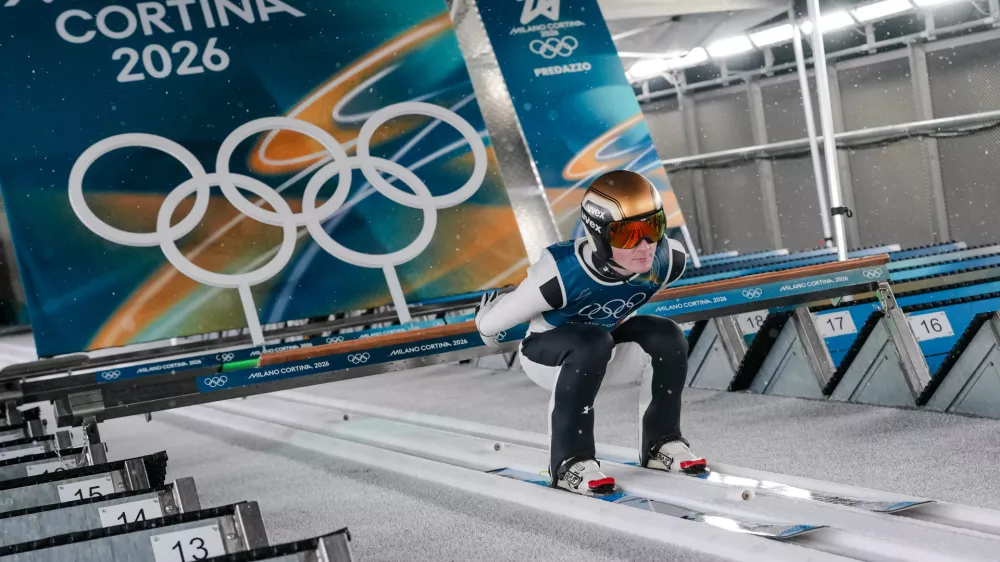 Domen Prevc, of Slovenia, goes down the ramp during his trial jump of the ski jumping men's large hill individual at the 2026 Winter Olympics, in Predazzo, Italy, Saturday, Feb. 14, 2026. (AP Photo/Evgeniy Maloletka)
