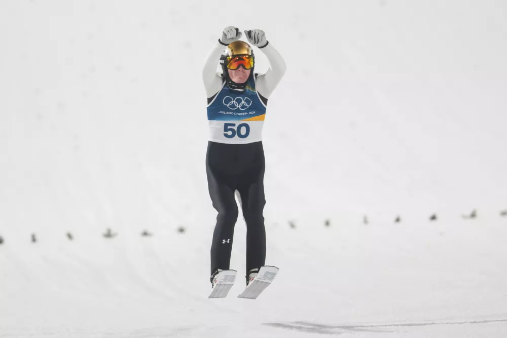 Italija, Predazzo.Zimske olimpijske igre 2026.Smucarski skoki, velika skakalnica, moski.Olimpijski prvak na veliki skakalnici Domen Prevc.