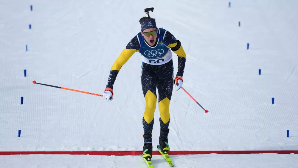 Martin Ponsiluoma, of Sweden, crosses the finish line of the men's 10-kilometer sprint biathlon race at the 2026 Winter Olympics in Anterselva, Italy, Friday, Feb. 13, 2026. (AP Photo/Andrew Medichini)