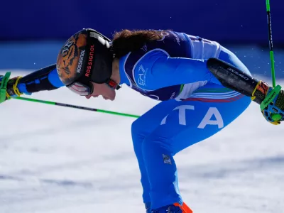 Italy's Federica Brignone celebrates winning an alpine ski, women's giant slalom race, at the 2026 Winter Olympics, in Cortina d'Ampezzo, Italy, Sunday, Feb. 15, 2026.(AP Photo/Robert F. Bukaty)