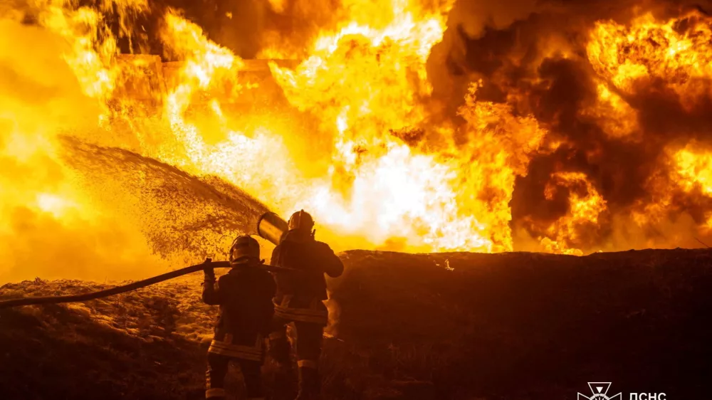 Firefighters work at the site of a railway infrastructure facility hit during overnight Russian drone strikes, amid Russia's attack on Ukraine, in Odesa, Ukraine February 15, 2026. Press service of the State Emergency Service of Ukraine in Odesa region/Handout via REUTERS ATTENTION EDITORS - THIS IMAGE HAS BEEN SUPPLIED BY A THIRD PARTY. DO NOT OBSCURE LOGO.   TPX IMAGES OF THE DAY