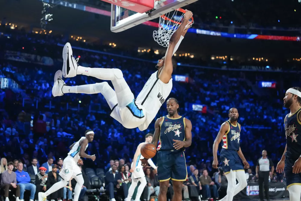 Feb 15, 2026; Inglewood, California, USA; Team World center Victor Wembanyama (1) of the San Antonio Spurs dunks the ball in game three during the 75th NBA All Star Game at Intuit Dome. Mandatory Credit: Kirby Lee-Imagn Images