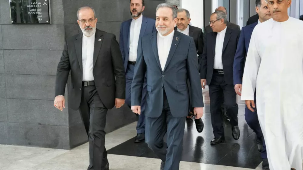FILE - In this photo released by the Iranian Foreign Ministry, Iranian Foreign Minister Abbas Araghchi, center, heads to the venue for talks between Iran and the U.S., in Muscat, Oman, Friday, Feb. 6, 2026. (Iranian Foreign Ministry via AP, File)