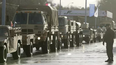 U.S. Army vehicles cross the Polish border in Olszyna, Poland, Thursday, Jan. 12, 2017 heading for their new base in Zagan. First U.S. troops arrive in Zagan in western Poland as part of deterrence force of some 1,000 troops to be based here and reassure Poland that is worried about Russia's activity. (AP Photo/Czarek Sokolowski)