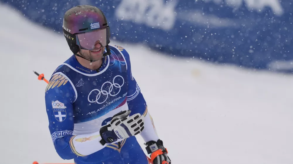 Greece's Aj Ginnis arrives at the finish area of an alpine ski, men's slalom race, at the 2026 Winter Olympics, in Bormio, Italy, Monday, Feb. 16, 2026. (AP Photo/Rebecca Blackwell)