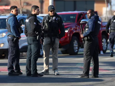 Police congregate near the Lynch Arena in Pawtucket, R.I., after a shooting occurred at the ice rink, Monday, Feb. 16, 2026. (AP Photo/Mark Stockwell)