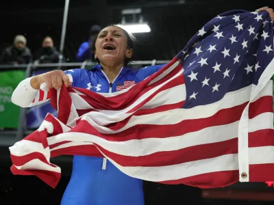 Milano Cortina 2026 Olympics - Bobsleigh - Women's Monobob Heat 4 - Cortina Sliding Centre, Cortina d'Ampezzo, Italy - February 16, 2026. Gold medallist Elana Meyers Taylor of United States celebrates winning Women's Monobob REUTERS/Athit Perawongmetha