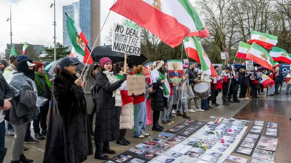 Iranian protesters hold placards and portraits as they demonstrate in front of United Nations office ahead of indirect nuclear talks between the United States and Iran in Geneva, Switzerland, Tuesday, Feb. 17, 2026. (Martial Trezzini/Keystone via AP)