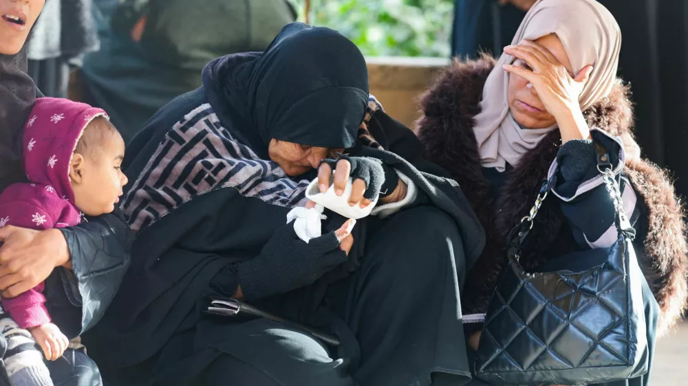 Mourners react during the funeral of Palestinians killed in an overnight Israeli strike, according to medics, at Nasser Hospital in Khan Younis in the southern Gaza Strip, February 15, 2026. REUTERS/Ramadan Abed
