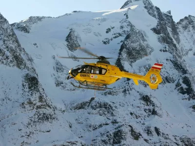 "Grossglockner, Austria - October 30, 2011: Rescue helicopter from Austrian Mountain Rescue Service flying at accident site at October 30, 2011. At 2001 Rescue Service performed a total of 6508 rescues."