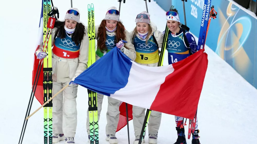 Milano Cortina 2026 Olympics - Biathlon - Women's 4 x 6km Relay - Anterselva Biathlon Arena, South Tyrol, Italy - February 18, 2026. Camille Bened of France, Lou Jeanmonnot of France, Oceane Michelon of France and Julia Simon of France celebrate after winning gold during the Women's 4 x 6km Relay. REUTERS/Eloisa Lopez