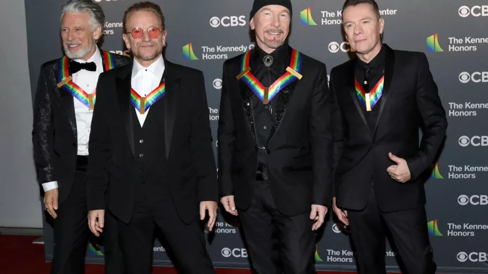 FILE - Adam Clayton, from left, Bono, The Edge and Larry Mullen Jr., of the Irish band U2, arrive at the Kennedy Center Honors in Washington on Dec. 4, 2022. (Photo by Greg Allen/Invision/AP, File)