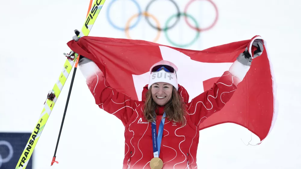 Switzerland's Marianne Fatton celebrates winning a gold medal a ski mountaineering women's final at the 2026 Winter Olympics, in Bormio, Italy, Thursday, Feb. 19, 2026. (AP Photo/Gabriele Facciotti)