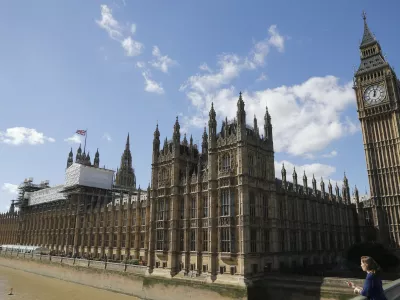 General view of the Houses of Parliament with scaffolding erected around a section of it in London, Thursday, Sept. 8, 2016. A committee charged with stopping Britain's creaky, leaky Parliament from falling down is set to say whether lawmakers will have to move out for several years so repair work can be done. The Joint Committee on the Palace of Westminster has been studying options for the 19th-century complex, which needs work to repair collapsing roofs, crumbling walls and leaking pipes, and to remove asbestos. (AP Photo/Frank Augstein)
