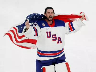 Milano Cortina 2026 Olympics - Ice Hockey - Men's Gold Medal Game - Canada vs United States - Milano Santagiulia Ice Hockey Arena, Milan, Italy - February 22, 2026. Connor Hellebuyck of United States celebrates with his national flag after winning gold REUTERS/David W Cerny   TPX IMAGES OF THE DAY