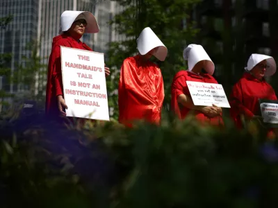 Protestors dressed as handmaids attend a pro-abortion rights demonstration outside the Embassy of the United States of America in central London, Britain, May 7, 2022. REUTERS/Henry Nicholls