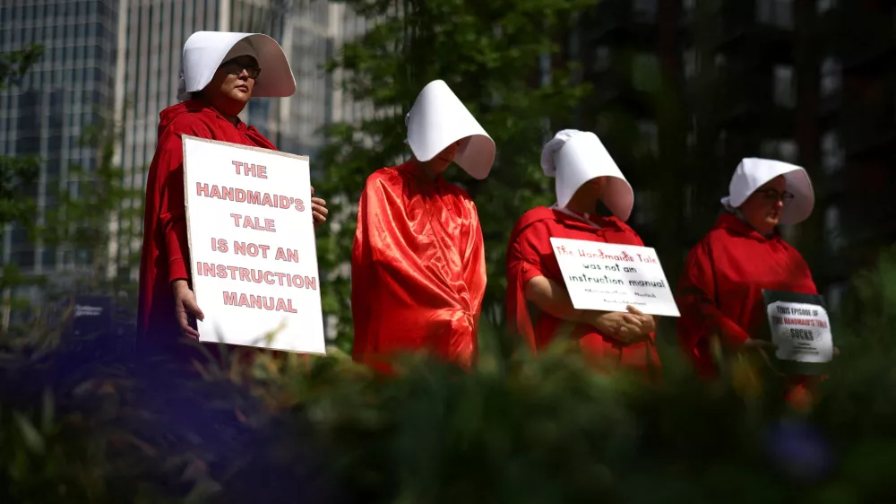 Protestors dressed as handmaids attend a pro-abortion rights demonstration outside the Embassy of the United States of America in central London, Britain, May 7, 2022. REUTERS/Henry Nicholls
