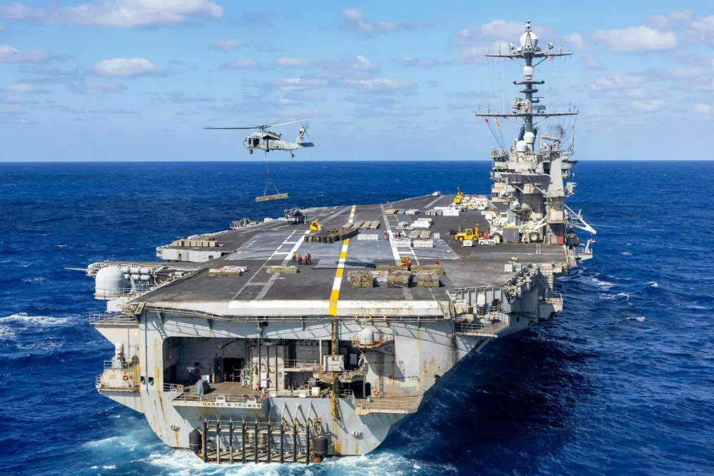 August 4, 2025 - Norfolk, Atlantic Ocean - An MH-60S Sea Hawk helicopter, attached to the Dragonslayers of Helicopter Sea Combat Squadron (HSC) 11, transports ordnance from the flight deck of the Nimitz-class aircraft carrier USS Harry S. Truman (CVN 75) to the Lewis and Clark-class supply ship USNS Robert E. Peary (T-AKE 5) during an ammunition offload. Truman is currently underway in the Atlantic Ocean. (Credit Image: ? US Navy/ZUMA Press Wire)
