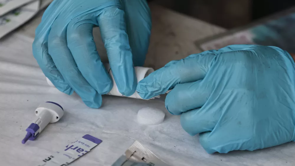 February 21, 2026, Mexico City, Cdmx, Mexico: A member of the ALFA/Inclusive Collective, who is reading this, prepares the material to carry out the tests to detect HIV, Syphilis and HCV in a work area for sex workers on February 21, 2026 in Mexico City. The ALFA/Inclusive Collective is a non-profit organization dedicated to promoting sexual health and providing free rapid HIV, syphilis, and HCV testing. They offer free support to the LGBTQ+ community, transgender sex workers, gay men, and anyone who needs it. They offer this service monthly in various parts of the city. This time, they conducted testing outside the San Fernando Cemetery, which is part of a sex work corridor that includes Alameda Central, Puente de Alvarado, Zona Rosa, Sullivan, and other areas of the city known for easy access to this profession, considered the oldest in the world. The ALFA/Inclusive Collective, which has been in existence for about three years, is comprised of Rogelio J. Gomez Rivera (General Director), Jannu Lira Alatorre (Operations Director), and a professional, specialized, and trained team that conducts these tests, provides follow-up, and offers support in case of positive or reactive test results. (Credit Image: &copy; Josue P&Atilde;&copy;Rez/Nexpher Images via ZUMA Press Wire)