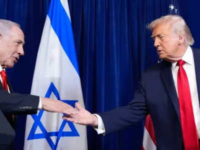 President Donald Trump shakes hands with Israel's Prime Minister Benjamin Netanyahu during a news conference at Mar-a-Lago, Monday, Dec. 29, 2025, in Palm Beach, Fla. (AP Photo/Alex Brandon)