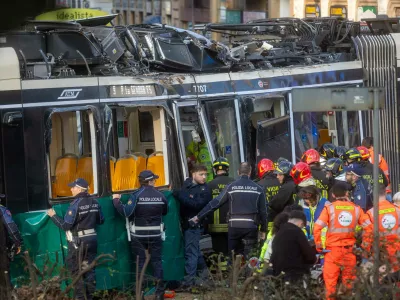 Rescuers and police officers work at the scene of a derailment on Line 9 in Milan, Italy, Friday, Feb. 27, 2026. (Stefano Porta/LaPresse via AP)