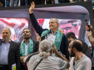 FILED - 23 June 2024, Iran, Tehran: Massud Peseschkian (C), presidential candidate of the reformist camp, arrives at an election rally in the capital. Photo: Arne Immanuel B&auml;nsch/dpa