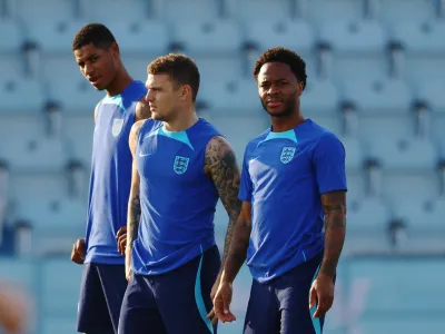 Soccer Football - FIFA World Cup Qatar 2022 - England Training - Al Wakrah SC stadium, Al Wakrah, Qatar - December 3, 2022 England's Marcus Rashford, Kieran Trippier and Raheem Sterling during training REUTERS/Hannah Mckay