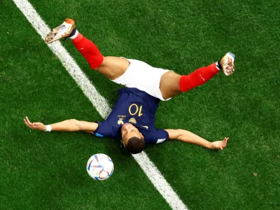 Soccer Football - FIFA World Cup Qatar 2022 - Quarter Final - England v France - Al Bayt Stadium, Al Khor, Qatar - December 10, 2022 France's Kylian Mbappe goes down REUTERS/Peter Cziborra   TPX IMAGES OF THE DAY