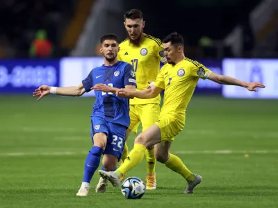 Soccer Football - UEFA Euro 2024 Qualifiers - Group H - Kazakhstan v Slovenia - Astana Arena, Astana, Kazakhstan - March 23, 2023 Slovenia's Adam Gnezda Cerin in action with Kazakhstan's Aslan Darabayev and Abat Aimbetov during the match REUTERS/Pavel Mikheyev