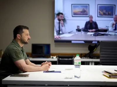 FILE PHOTO: Ukraine's President Volodymyr Zelenskiy speaks with representatives of the British defense company BAE Systems &ndash; CEO Charles Woodburn, Managing Director Gabby Costigan and Director for cooperation with Ukraine Christian Seear via video call, amid Russia's attack on Ukraine, in Kyiv, Ukraine, in this handout picture released May 30, 2023. Ukrainian Presidential Press Service/Handout via REUTERS ATTENTION EDITORS - THIS IMAGE HAS BEEN SUPPLIED BY A THIRD PARTY. MANDATORY CREDIT./File Photo