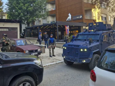 Kosovo police officers search restaurant and building in northern Serb-dominated part of ethnically divided town of Mitrovica, Kosovo, Friday, Sept. 29, 2023. In one of the worst confrontations since Kosovo declared independence from Serbia in 2008, about 30 masked men opened fire on a police patrol near the village of Banjska early Sunday. One Kosovo police officer and three gunmen were killed in Sunday's shootout between Serb insurgents and Kosovo police. (AP Photo/Radul Radovanovic)