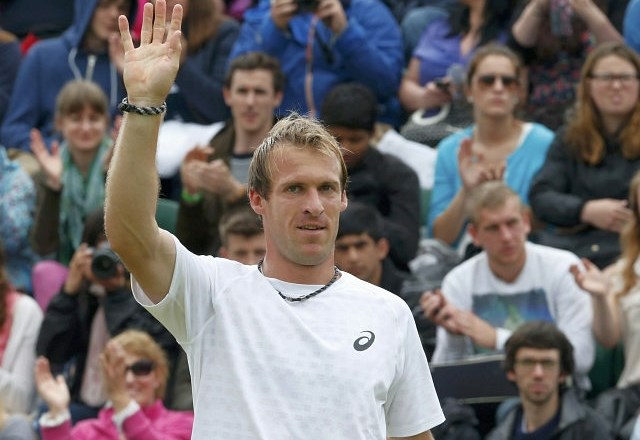 Grega Žemlja se je veselil uvrstitve v tretji krog Wimbledona, kjer ga čaka Juan Martin del Potro. (foto: Reuters) 