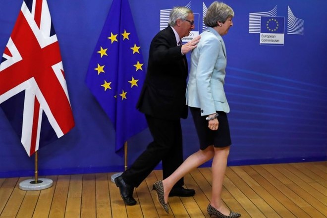 Britanska premierka Theresa May in predsednik Evropske komisije Jean-Claude Juncker.