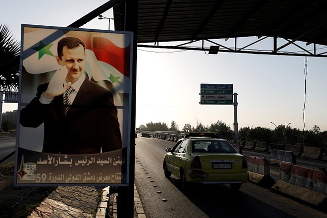 Plakat s podobo predsednika Bašarja al Asada.