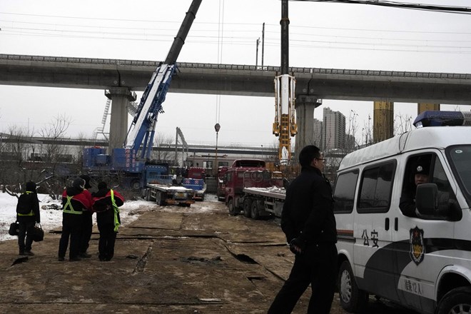 #foto V železniški nesreči v Pekingu več sto poškodovanih