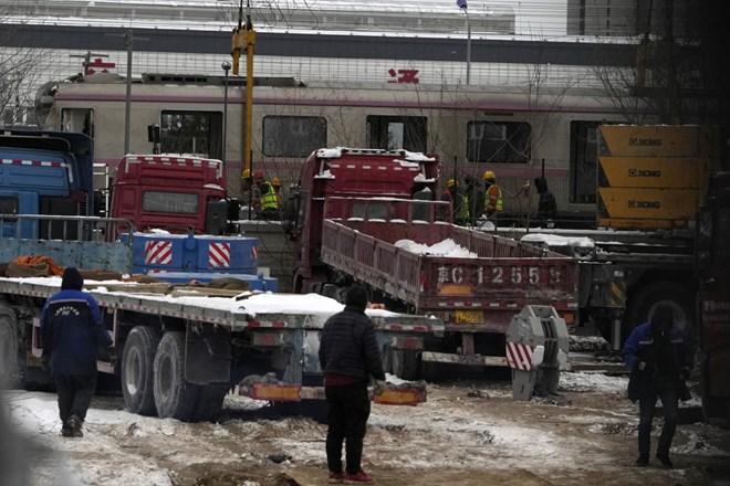 #foto V železniški nesreči v Pekingu več sto poškodovanih
