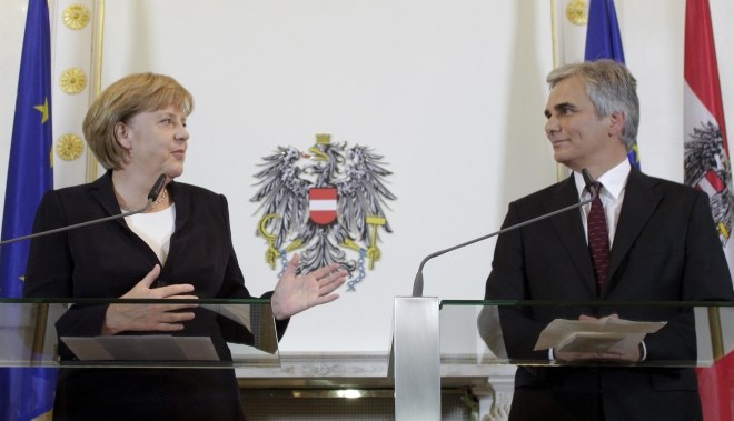 Angela Merkel in Werner Faymann.
