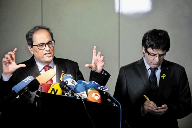 Predsednik Katalonije Quim Torra (levo) s svojim predhodnikom Carlesom Puigdemontom