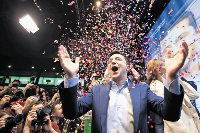 Ukrainian presidential candidate Volodymyr Zelenskiy reacts following the announcement of the first exit poll in a...