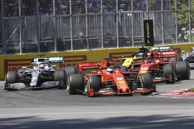 Vettel prvi čez ciljno črto, zmaga pa Hamiltonu