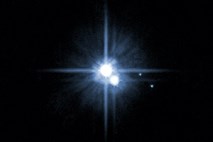 Pluton do številnih lun zaradi trka z drugim vesoljskim telesom