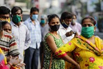 Koronavirus: v Indiji več kot sedem milijonov okužb, v Braziliji 150 tisoč mrtvih
