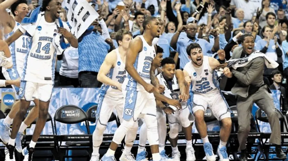 Takole se je ekipa Severne Karoline veselila uvrstitve na sklepni turnir NCAA letos, po zmagi v konferenčnem finalu Juga proti izjemno močnemu Kentuckyju.