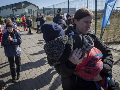 Ukrainian refugees arrive at the crossing border in Medyka, southeastern Poland, on Friday, March 11, 2022. Thousands of people have been killed and more than 2.3 million have fled the country since Russian troops crossed into Ukraine on Feb. 24. (AP Photo/Visar Kryeziu)