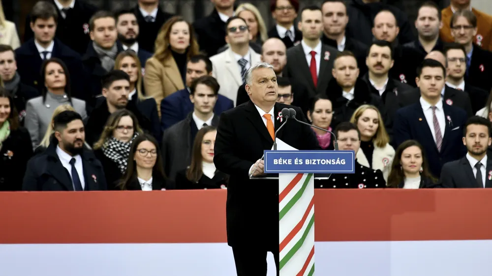 Hungary's right-wing populist prime minister, Viktor Orban addresses thousands of supporters as they gather in Budapest, Hungary, Tuesday, March 15, 2022. The so-called "peace march" was a show of strength by Orban's supporters ahead of national elections scheduled for April 3, while a coalition of six opposition parties also held a rally in the capital. (AP Photo/Anna Szilagyi)